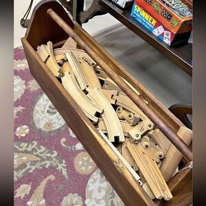 Vintage wooden train with track and extra blocks in a vintage handmade tool box
